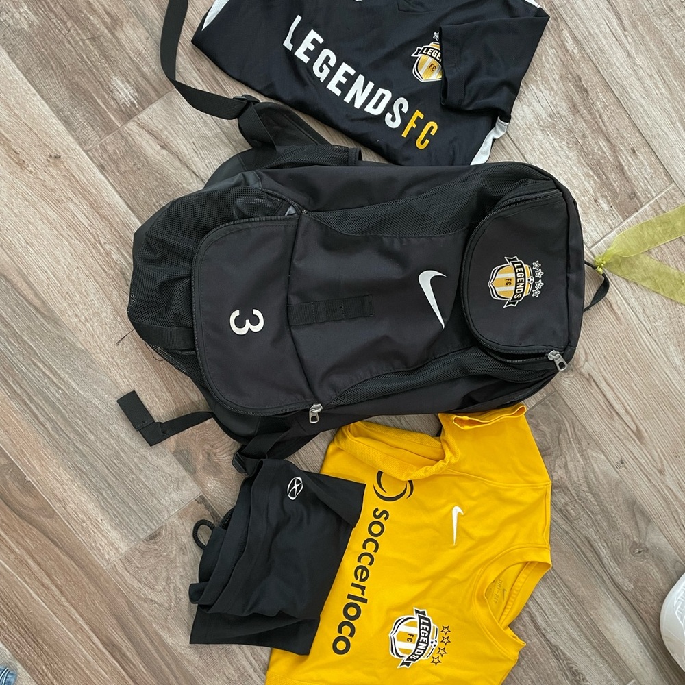 Legends Soccer backpack and 1 #3 jersey YS, 1 practice jerseyYS, and shirts
